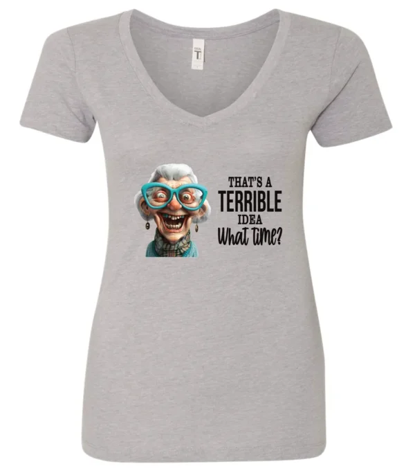 silver funny sarcastic v-neck t-shirt featuring a very happy, smiling old woman with white hair and big blue glasses, saying that’s a terrible idea, what time?