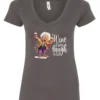 gray funny wine v-neck t-shirt featuring an old woman laughing with white hair glasses and two glasses of wine, with the quote wine a little, laugh a lot
