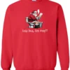 red Christmas humor sweatshirt featuring santa claus sitting on the toilet, reading the newspaper and smoking a cigarette, and it says cookie break gone wrong
