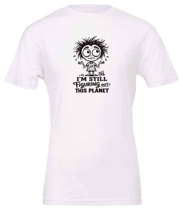 white t-shirt saying i'm still figuring out this planet featuring a confused allien