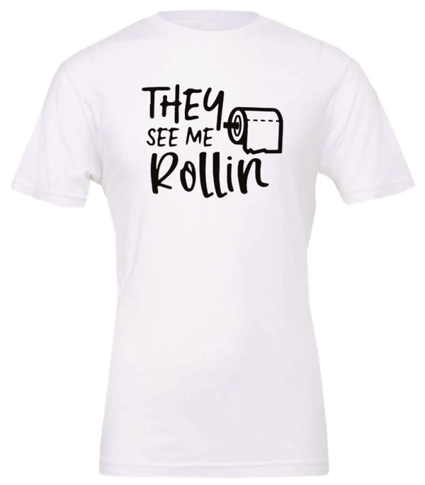 white t-shirt featuring a toilet paper saying they see me rollin