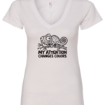 white v-neck t-shirt with a chameleon on a tree branch saying my attention changes colors
