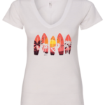 white v-neck t-shirt with 5 surfing tables with palm trees, the sun and a guy surfing printed on it
